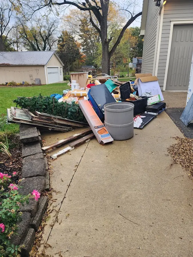 Dumpster being loaded with debris for Residential Dumpster Rental in Sweetwater